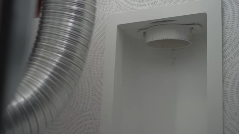 imgi_77_woman-disconnects-the-dryer-vent-hose-from-the-wall